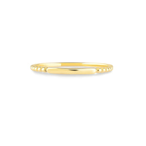 Introducing the 14K Solid Gold Minimalist Stacking Ring, a simple and elegant piece featuring a smooth, thin band with sides adorned in small, round bead-like designs. Its polished surface makes it ideal for sophisticated style and those who appreciate dainty elegance.