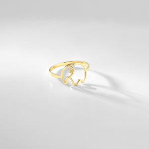 Introducing the 14K Solid Gold Diamond Elephant Ring, featuring an open design with a small diamond accent as the elephant's eye. This minimalist and elegant piece showcases the sleek lines of an elephant shape.