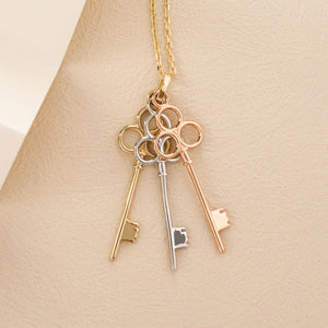 Introducing the 14K Solid Gold Friendship & Love Key Necklace, a captivating piece adorned with three elegant pendants in gold, silver, and rose gold. These graceful pendants elegantly dangle from the chain, making this exquisite necklace a perfect choice for an anniversary gift to cherish someone special.