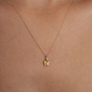 Product Description: A finely crafted 14K gold necklace featuring a marquise-cut citrine gemstone set in the center of an elegant butterfly design, displayed on a minimalistic chain against a plain white background.