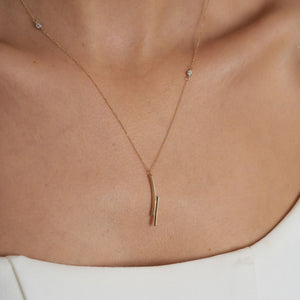 14k Solid Gold Minimal Bar Diamond Necklace by RundaJewelryUs, highlighting a minimalist pendant design with two elongated, intersecting bars on a delicate chain, elegantly displayed against a plain white background.