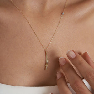 14k Solid Gold Minimal Bar Diamond Necklace by RundaJewelryUs, highlighting a minimalist pendant design with two elongated, intersecting bars on a delicate chain, elegantly displayed against a plain white background.