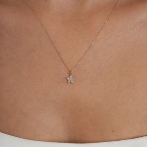 A 14K gold chain necklace from RundaJewelryUs, featuring a pendant shaped like a flower, crafted from six small round diamonds.