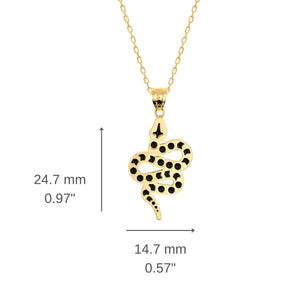 The 14K Solid Gold Snake Necklace features a pendant that beautifully resembles a coiled serpent with intricate black spots. This elegant charm is suspended from a fine chain, set against a plain white background, creating an outstanding piece of jewelry.