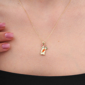 The 14K Gold Cute Rabbit Holding Carrot Necklace by RundaJewelryUs features a delicate rabbit-shaped pendant crafted from 14K gold, with vibrant red and orange enamel accents on its ears and body. Ideal for those who love distinctive jewelry, this piece adds a whimsical touch to any collection.