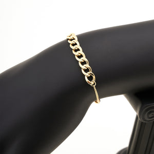 The 14K Solid Gold Bracelet from the Harmony Collection elegantly combines curb link designs with delicate smaller links on each side. Crafted in hypoallergenic 14K solid gold, it features a circular clasp and a round charm engraved with a symbol, available in your choice of yellow, white, or rose gold.