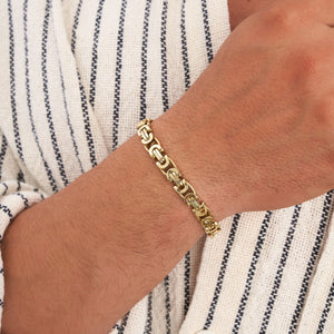 Explore the elegance of the 14K Solid Gold Byzantine Bracelet for Men, featuring a captivating combination of interlocking oval and rectangular links inspired by king chain designs. A circular clasp is elegantly positioned at the top, enhancing its sleek, polished finish against a plain white background.