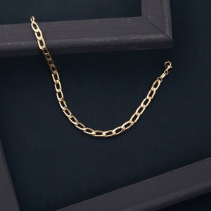 The 14K Real Gold Cuban Curb Link Chain Necklace, featuring elongated links, is showcased against a plain white background. It forms a U shape, emphasizing its simple yet elegant design—ideal for both men and women.