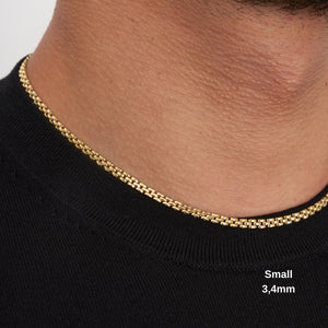 A close-up image highlights a 14K real solid gold Bismarck chain necklace for men, featuring a textured, woven design. The necklace is elegantly arranged in a gentle loop against a plain white background.