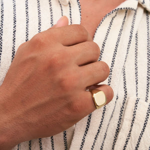 The 14K Solid Gold Plain Polished Signet Ring For Men, featuring a sleek, flat top surface against a white background, exemplifies timeless men's jewelry.