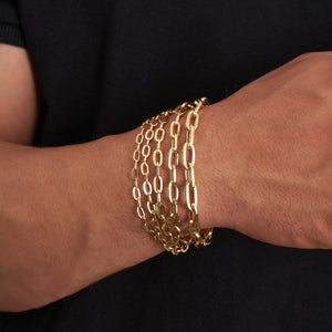 A close-up image of a 14K real solid gold chain bracelet designed for men with a straightforward and elegant link style against a plain white background. This unisex piece of jewelry subtly curves, highlighting its smooth texture and polished finish.