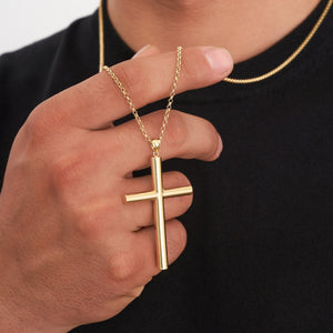 The 14K Solid Gold Cross Necklace for Men features a beautifully polished cross pendant on a classic gold chain, offering timeless religious jewelry set against a simple white background.