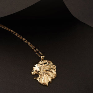 The 14K Solid Gold Lion Head Necklace for Men is a striking piece of animal jewelry, showcasing a detailed roaring lions head pendant with an intricate mane, elegantly hanging from a delicate chain on a plain white background.