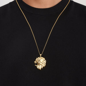 The 14K Solid Gold Lion Head Necklace for Men is a striking piece of animal jewelry, showcasing a detailed roaring lions head pendant with an intricate mane, elegantly hanging from a delicate chain on a plain white background.