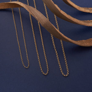 The 14K Solid Rolo Cable Link Chain Necklace for Men features a sleek design with small, round links in a consistent pattern, creating a complete loop. Set against a plain white background, this gold chain epitomizes minimalist elegance.