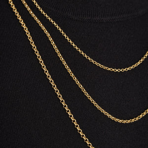 The 14K Solid Rolo Cable Link Chain Necklace for Men features a sleek design with small, round links in a consistent pattern, creating a complete loop. Set against a plain white background, this gold chain epitomizes minimalist elegance.