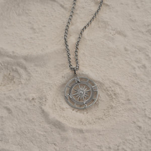 The 14K Solid Gold Compass Necklace for Men makes an ideal graduation gift, with its pendant showcasing a compass design. It features intricate engravings and a central compass rose shape resembling a North Star, elegantly suspended on a fine chain.