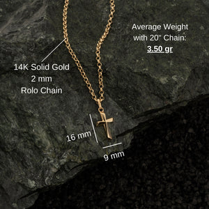 The 14K Gold Tiny Cross Necklace for Men showcases a small, polished cross pendant gracefully centered on a chain of fine, uniform links. This piece of religious jewelry offers a simple and elegant look, ideal for those seeking understated men's gold cross necklaces.