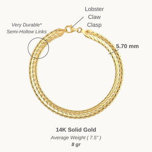 The 14K solid gold snake bracelet, with a smooth, glossy finish and secure clasp, forms an elegant circle. Its intricate pattern reflects light beautifully, showcasing the allure of exquisite gold jewelry.