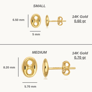 Displayed against a plain background, the 14K Solid Gold Puffed Mariner Anchor Stud Earrings feature an oval shape with two cut-out circles. These polished, nautical-inspired earrings exude timeless elegance, shown from both side and front views.