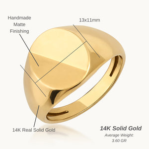 The 14K Solid Gold Matte & Polished Oval Signet Ring for Men features a flat, smooth oval-shaped top set against a plain white background. This engraved ring embodies timeless elegance and sophistication, making it a perfect choice for men's jewelry.