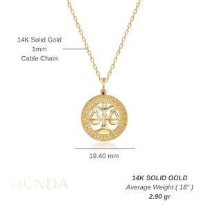 The 14K Gold Astrology Zodiac Charm Necklace by Runda Jewelry features a solid gold chain and a circular pendant adorned with an astrology zodiac symbol. The intricate detailing along the edge adds elegance to this charming necklace, set against a plain white background.